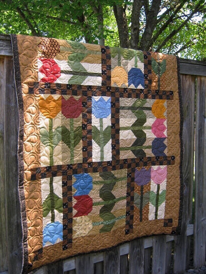 Laugh Yourself Into Stitches Tulip Crush Quilt Pattern Finished Size: 54”x72”